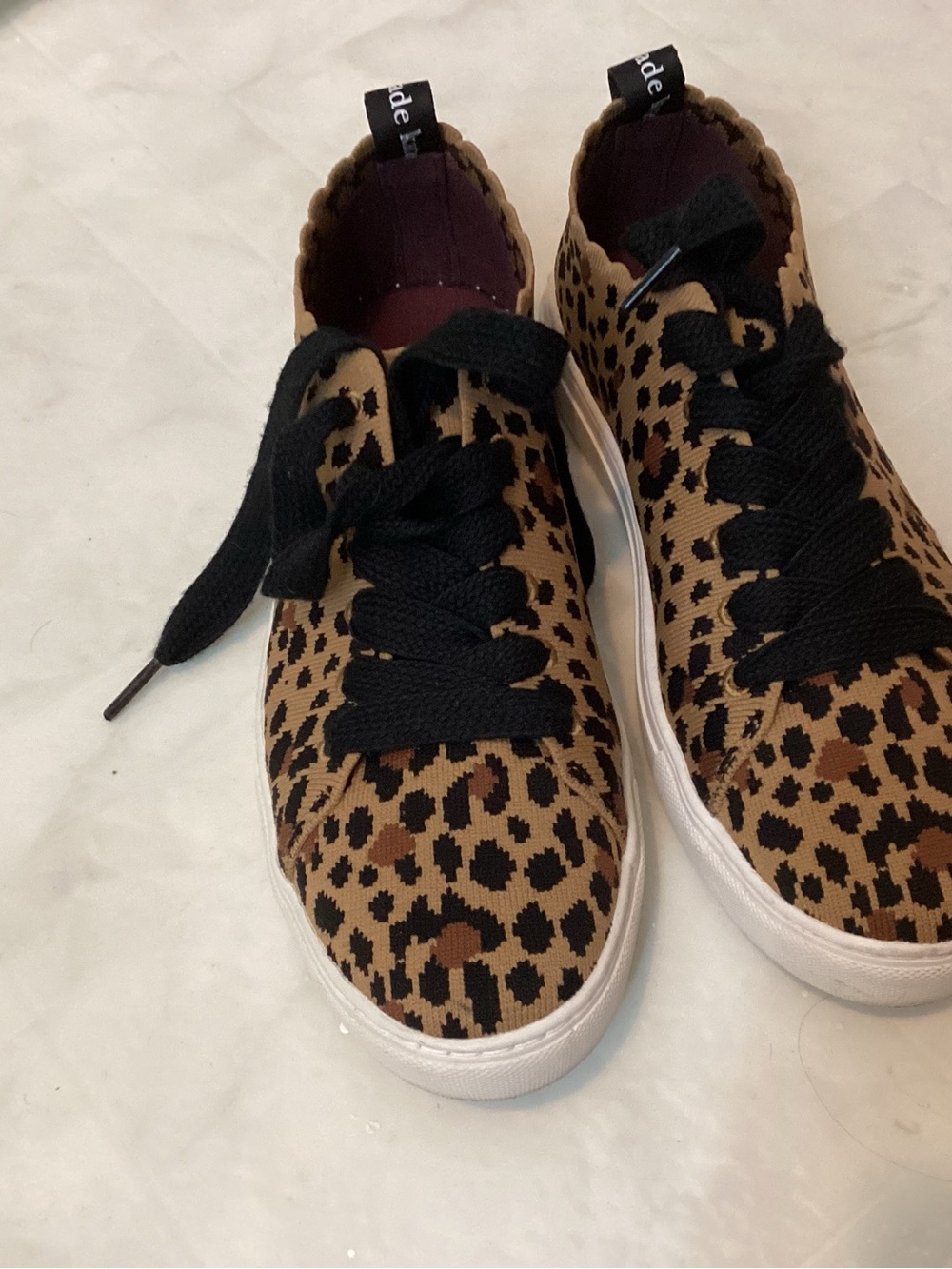 Kate Spade scallop leopard sneakers.
